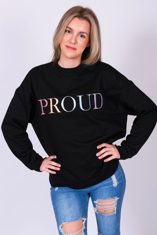 A beautiful black high quality oversized Jumper with a pastel rainbow letters spelling out 'PROUD.' The sleeves have reassuring messages which read 'I am Loved' and 'I am Worthy'